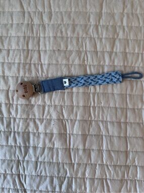 Blue bibs pacifier holder
